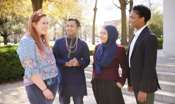 Students in talking in front of Denny Chimes